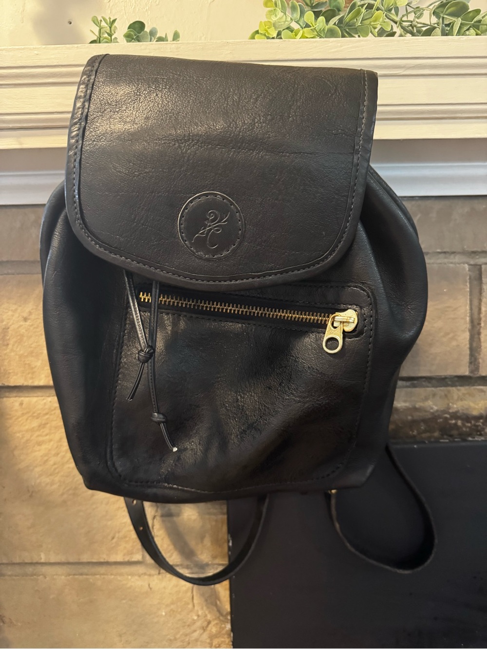 Black Leather Women’s Backpack with Front Zip and Drawstring Closure